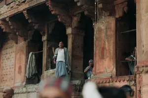 Men standing in the arched windows of an ancient temple, highlighting cultural architecture. jigsaw puzzle