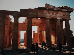 Discover the beauty of ancient architecture at sunset as tourists explore this iconic historic site. jigsaw puzzle