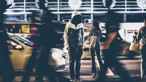 Dynamic night street scene capturing people and cars in motion blur. jigsaw puzzle