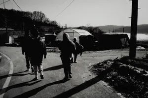 Group of people walking in a rural South Korean village, showcasing local life. jigsaw puzzle