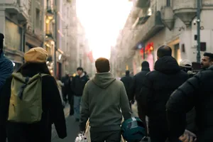 Busy city street at sunset with people walking in winter clothing. jigsaw puzzle