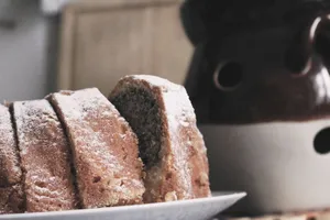 Delicious homemade Bundt cake dusted with powdered sugar, perfect for a cozy dessert. jigsaw puzzle
