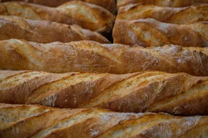 Close-up shot of multiple freshly baked crispy French baguettes in a bakery. jigsaw puzzle