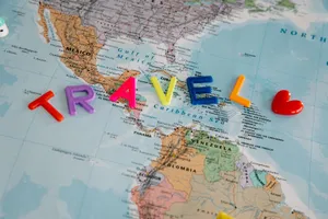 A vibrant map with colorful letters spelling 'TRAVEL', highlighting Central America and the Caribbean. jigsaw puzzle