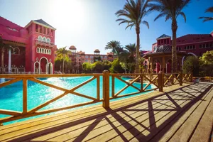Stunning tropical resort with luxurious poolside, palm trees, and vibrant architecture for ultimate relaxation. jigsaw puzzle