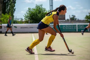 Young female athlete playing field hockey on a sunny day. jigsaw puzzle