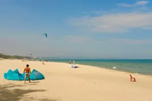 Beach activity with kite surfers on a sunny day in Binh Thuan, Vietnam. jigsaw puzzle