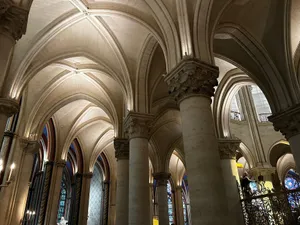 Intricate Gothic arches inside a historic Paris cathedral showcasing stunning architecture. jigsaw puzzle