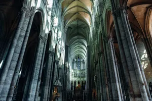 Explore the grand Gothic interior of Amiens Cathedral, renowned for its towering arches and stained glass windows. jigsaw puzzle