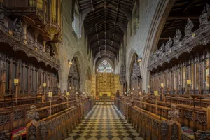 Stunning Gothic cathedral interior featuring intricate wooden choir stalls and ornate arches. jigsaw puzzle