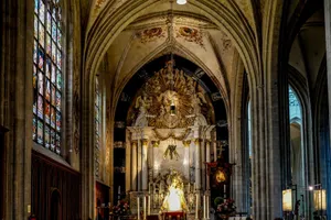 Stunning interior of a Gothic cathedral featuring a beautifully ornate altar and stained glass windows. jigsaw puzzle