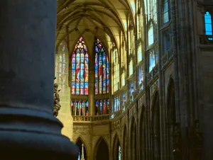 Intricate stained glass and gothic architecture inside Prague's St. Vitus Cathedral. jigsaw puzzle
