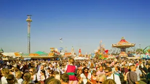 A lively scene at a crowded amusement park during the day. jigsaw puzzle