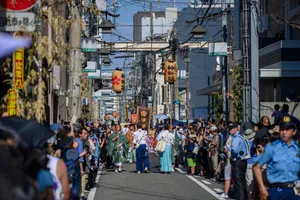Cultural street parade with traditional attire and decorations, showcasing vibrant community celebration. jigsaw puzzle