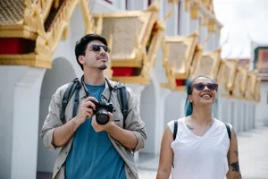 A couple explores a city's ornate architecture, capturing memories with a camera. jigsaw puzzle