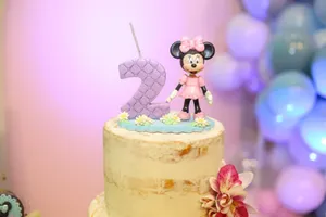 Delightful birthday cake featuring Minnie Mouse and number two topper, perfect for celebrations. jigsaw puzzle