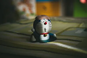 A Doraemon toy figurine with soft lighting and shadows, creating a vintage look. jigsaw puzzle