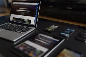 A contemporary workspace showcasing a laptop, tablet, and smartphones, ideal for tech and freelance use. jigsaw puzzle