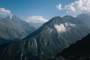 Stunning view of a rugged mountain range under a clear blue sky. jigsaw puzzle