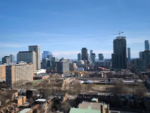 Aerial view of Toronto's modern downtown skyline under a clear blue sky. jigsaw puzzle