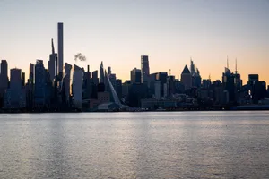 Captivating dawn view of the Manhattan skyline silhouetted against the morning sky. jigsaw puzzle