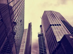 Dramatic view of towering skyscrapers in a vibrant cityscape jigsaw puzzle