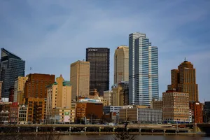 Stunning view of Pittsburgh's skyline featuring the iconic UPMC building under a clear sky. jigsaw puzzle