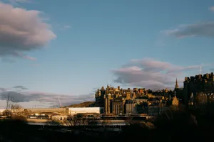 View of Edinburgh's historic architecture against a stunning sunset sky. jigsaw puzzle
