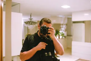 A photographer takes a photo in a stylish indoor setting with a Canon DSLR. jigsaw puzzle