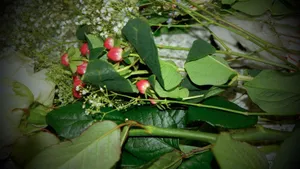 From above of fresh blooming flowers with green stems and leaves placed on light table jigsaw puzzle