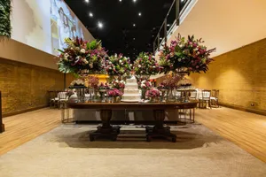 Luxurious wedding reception table decorated with flowers and a cake indoors. jigsaw puzzle