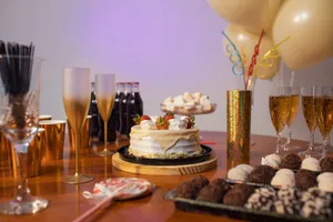 Festive Brazilian celebration setup with cake, drinks, and decorations. jigsaw puzzle