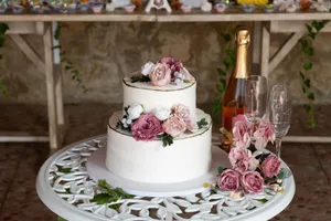 A beautiful wedding cake with floral decorations beside champagne in Lisboa, Portugal. jigsaw puzzle