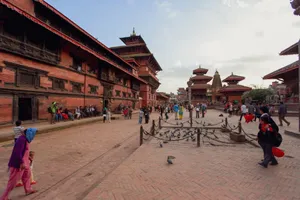 Patan Durbar Square with locals and tourists in Kathmandu, showcasing traditional architecture. jigsaw puzzle