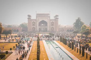 Crowds gather at the iconic entrance gate of the Taj Mahal in Agra, India, capturing its grandeur and architectural beauty. jigsaw puzzle