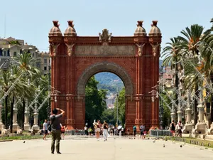 Visitors enjoy a sunny day at Arc de Triomf in Barcelona, capturing the historic landmark's beauty. jigsaw puzzle