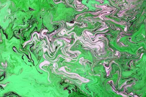Vibrant abstract marble pattern in green and pink, showcasing fluid and dynamic brush strokes. jigsaw puzzle
