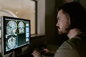 Radiologist examining a CT scan on a monitor in a medical facility. jigsaw puzzle