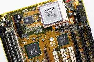 Close-up of a vintage AMD K6 CPU on a retro motherboard showing intricate electronic details. jigsaw puzzle