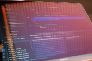 Focused view of a computer screen displaying programming code with visible reflections. jigsaw puzzle