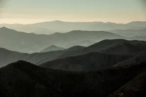 A breathtaking aerial view of the tranquil mountains in Pyeongchang, showcasing serene natural beauty. jigsaw puzzle