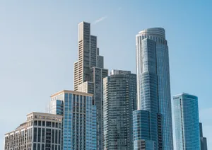 Contemporary skyscraper architecture in a clear blue sky view. jigsaw puzzle
