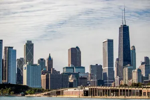 Stunning view of Chicago skyline featuring famous skyscrapers and urban architecture under a cloudy sky. jigsaw puzzle