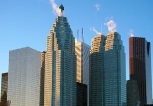 A stunning view of Toronto's skyscrapers under a clear blue sky, showcasing urban architecture. jigsaw puzzle