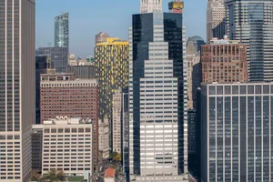 Captivating aerial shot of New York City's modern skyscrapers under a clear sky. jigsaw puzzle