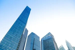 Majestic skyscrapers against a clear blue sky, showcasing urban architecture. jigsaw puzzle