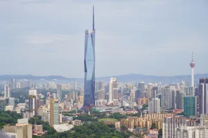 Stunning aerial view of Kuala Lumpur skyline featuring the Merdeka 118 and KL Tower on a clear day. jigsaw puzzle