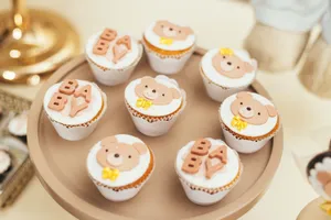 Cute baby shower cupcakes featuring bear decorations and BABY lettering on a stylish tray. jigsaw puzzle