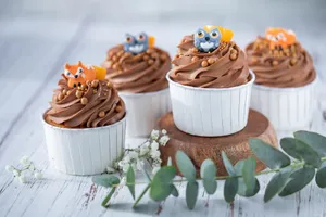 Delicious chocolate cupcakes topped with cute animal decorations, perfect for any celebration. jigsaw puzzle