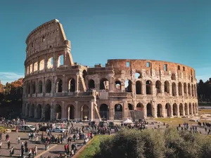 Historic Colosseum in Rome with tourists, showcasing ancient Roman architecture. jigsaw puzzle